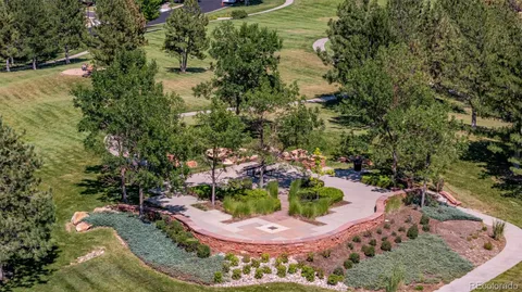 a view of a swimming pool with a yard