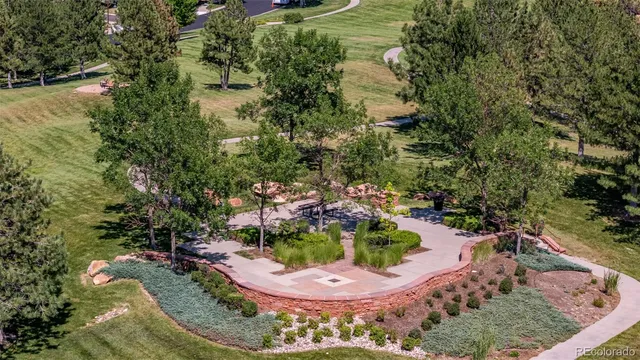 a view of a swimming pool with a yard