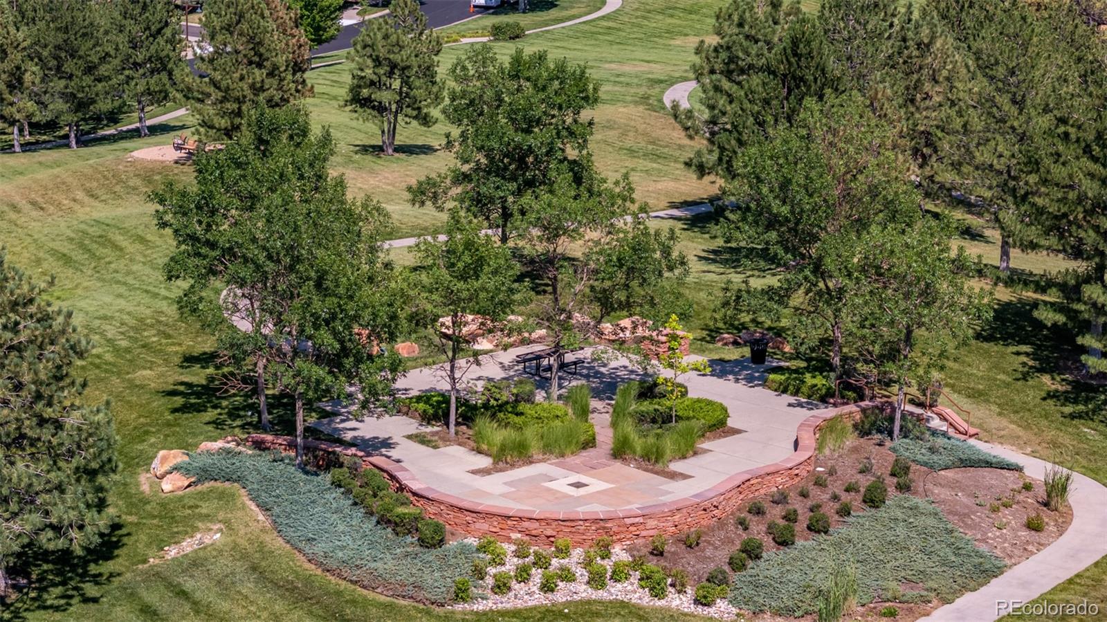 24248 East Roxbury Circle Aurora, CO 80016 - Photo 40 of 42 a view of a swimming pool with a yard