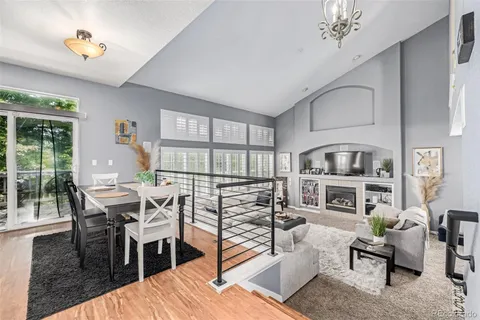 a bedroom with furniture and a wooden floor