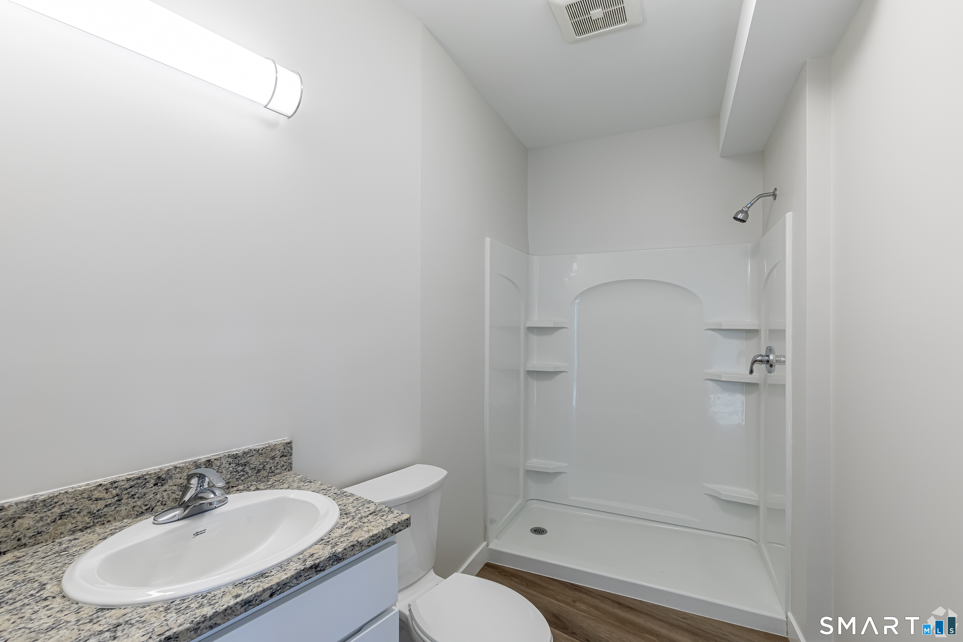 401 Albany Turnpike, Unit 311 Canton, CT 06019 - Photo 6 of 11 a bathroom with a sink toilet and shower