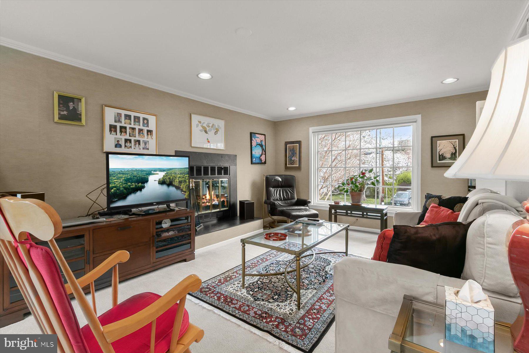 4716 Merivale Road Chevy Chase, MD 20815 - Photo 18 of 48 a living room with furniture a rug and a flat screen tv