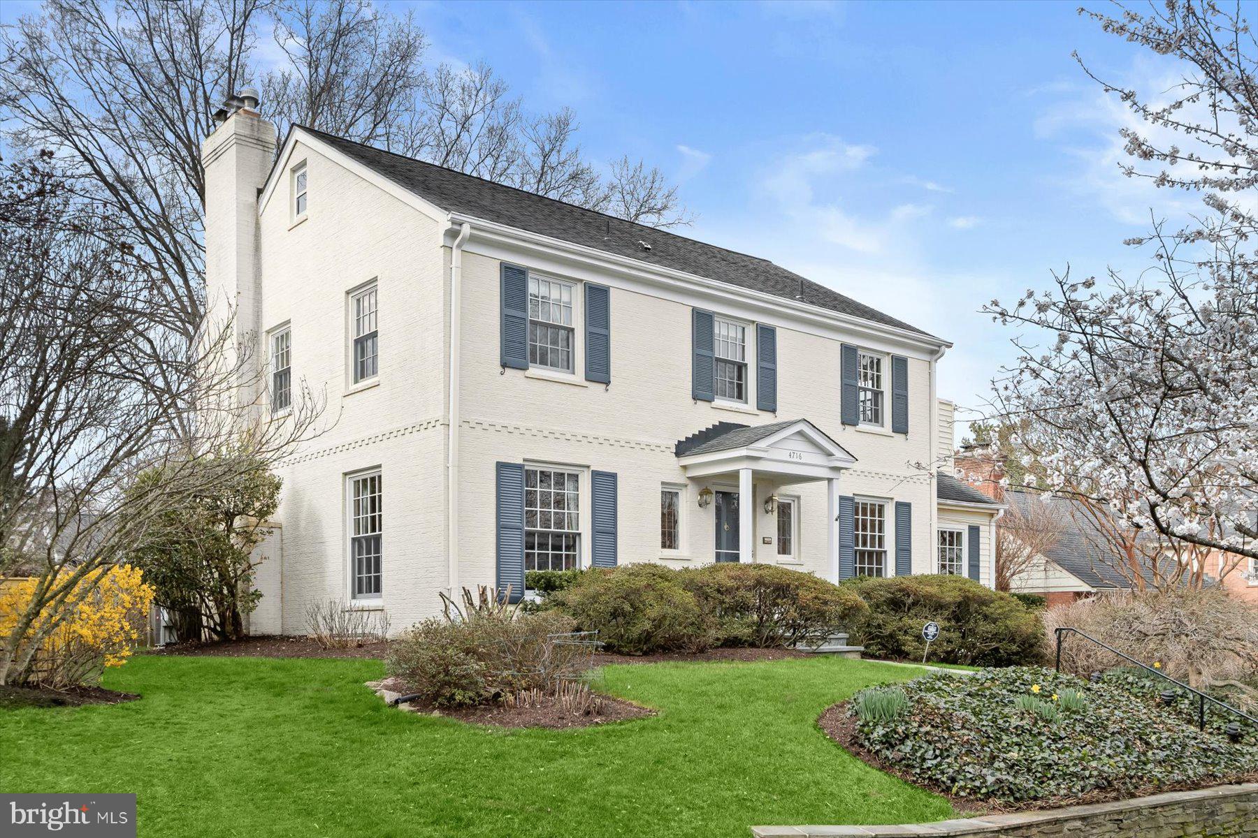 4716 Merivale Road Chevy Chase, MD 20815 - Photo 2 of 48 a front view of a house with a yard