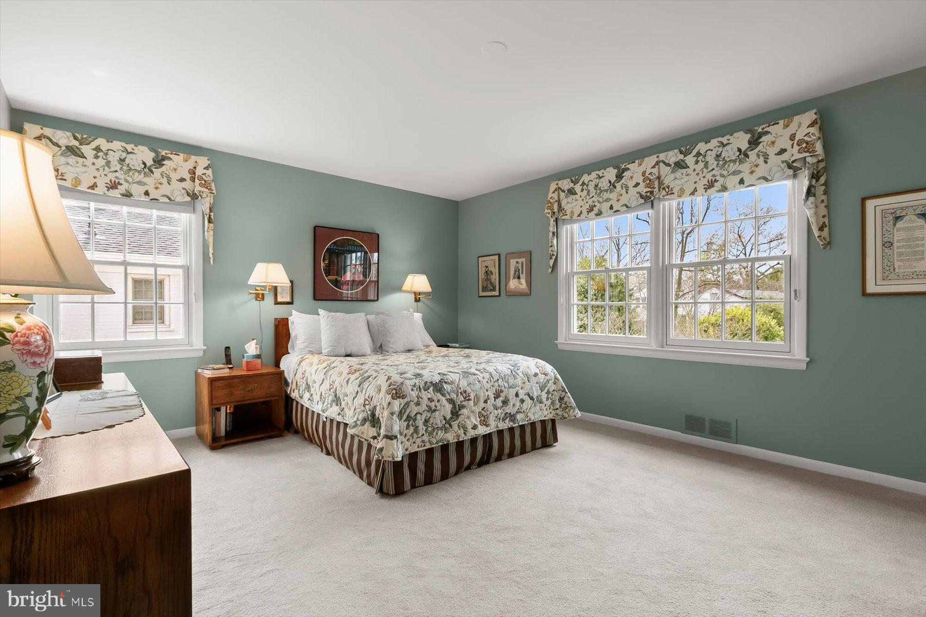 4716 Merivale Road Chevy Chase, MD 20815 - Photo 25 of 48 a bedroom with a large bed and a window