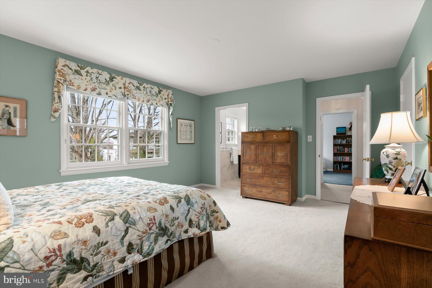 4716 Merivale Road Chevy Chase, MD 20815 - Photo 26 of 48 a bedroom with a bed and dresser with mirror