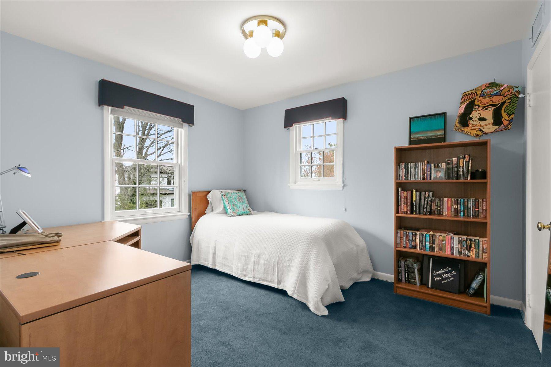 4716 Merivale Road Chevy Chase, MD 20815 - Photo 29 of 48 a bedroom with a bed and a window