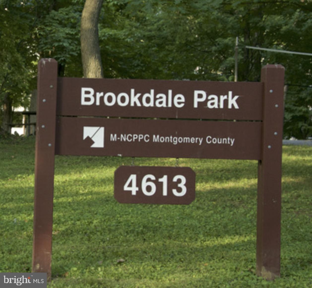 4716 Merivale Road Chevy Chase, MD 20815 - Photo 45 of 48 a sign broad in front of the red red brick house