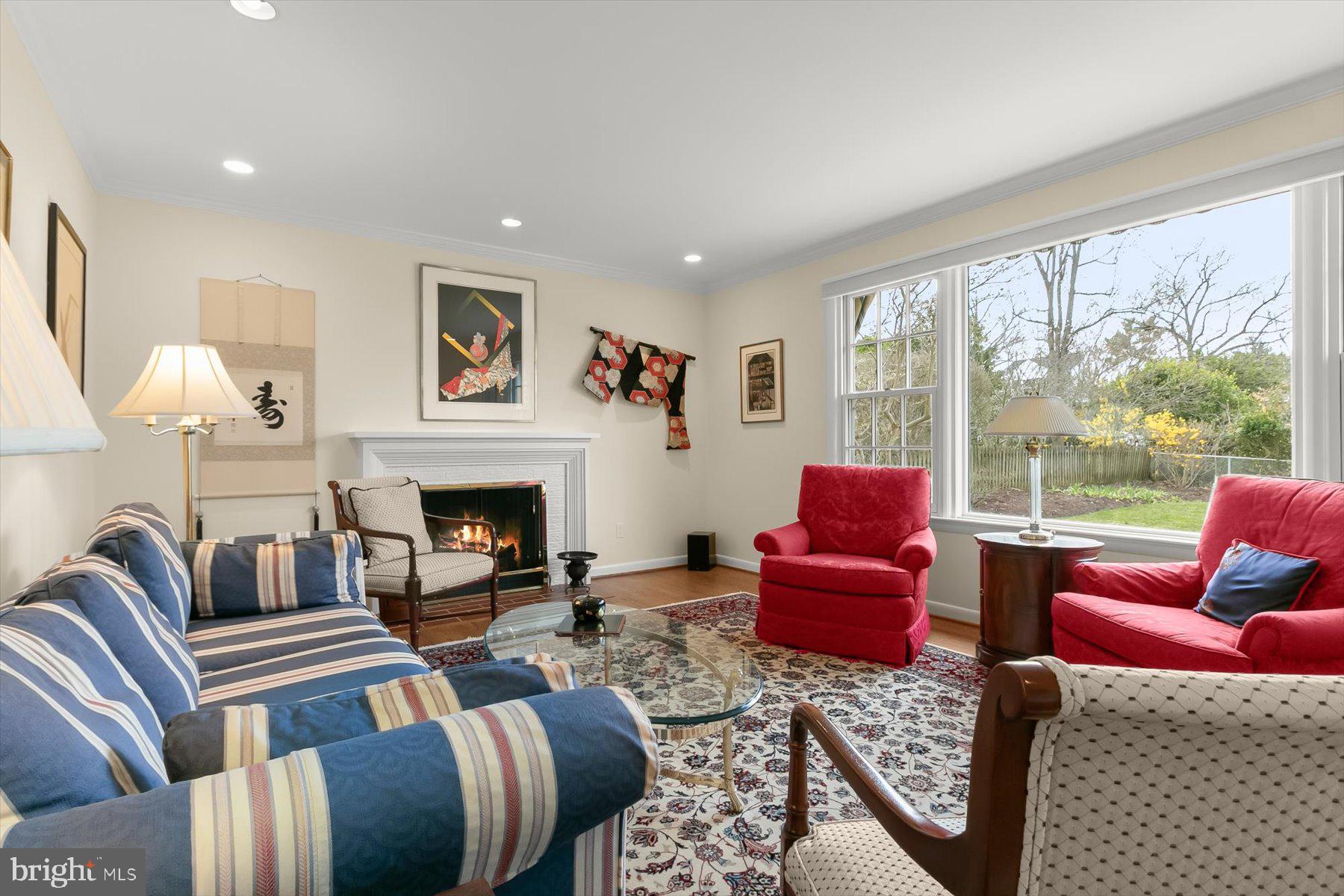 4716 Merivale Road Chevy Chase, MD 20815 - Photo 8 of 48 a living room with furniture fireplace and a large window