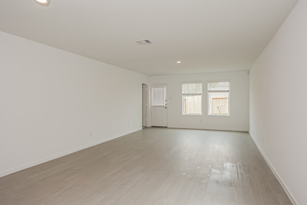 621 Craven Street Conroe, TX 77316 - Photo 4 of 16 an empty room with windows