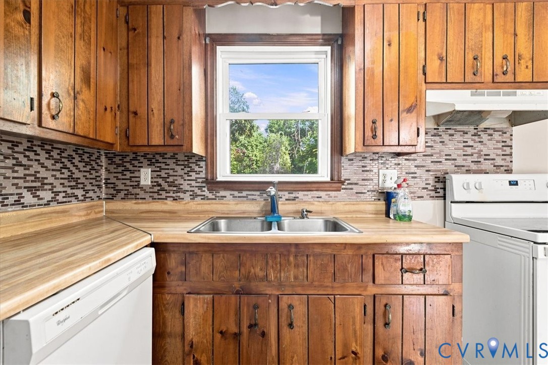 21103 Rabbit Run Petersburg, VA 23803 - Photo 9 of 27 Wood cabinetry and countertop surfaces with a stai