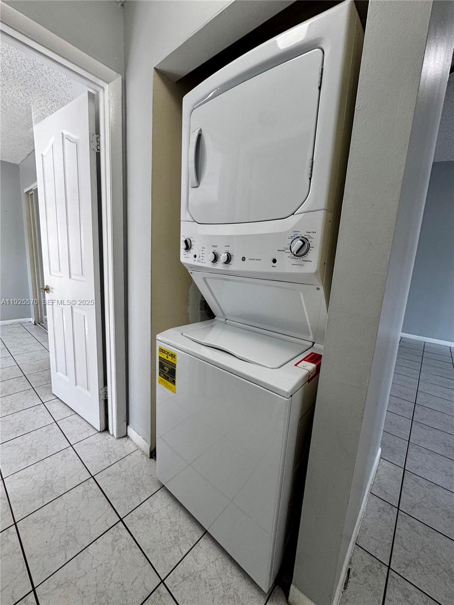 18250 Mediterranean Boulevard, Unit 1508 Hialeah, FL 33015 - Photo 25 of 26 a utility room with dryer and washer