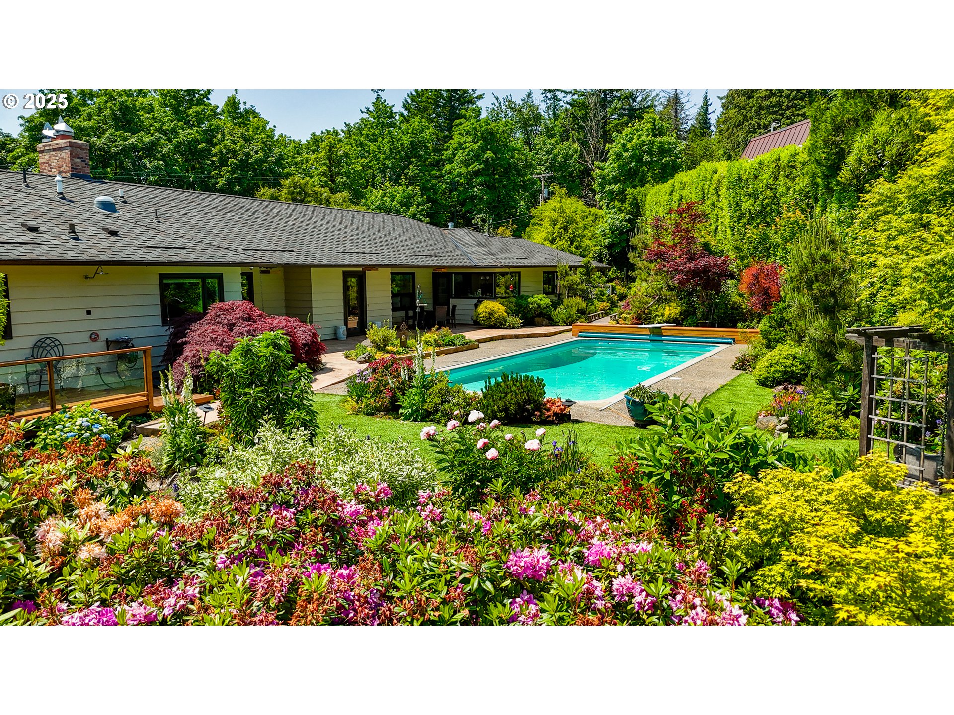 7131 Northwest Penridge Road Portland, OR 97229 - Photo 2 of 43 a view of a house with a garden