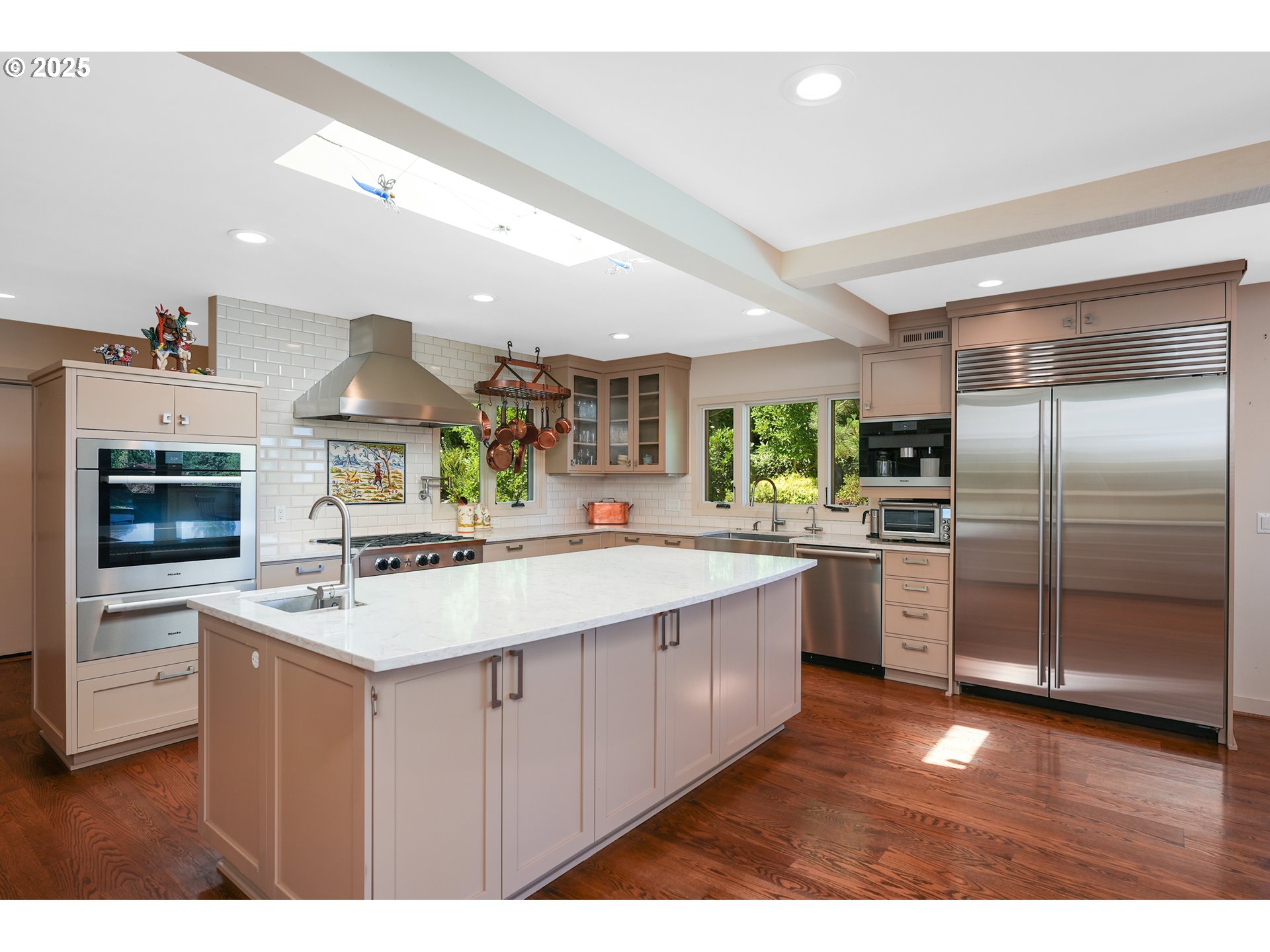 7131 Northwest Penridge Road Portland, OR 97229 - Photo 23 of 43 a kitchen with stainless steel appliances a sink and a refrigerator