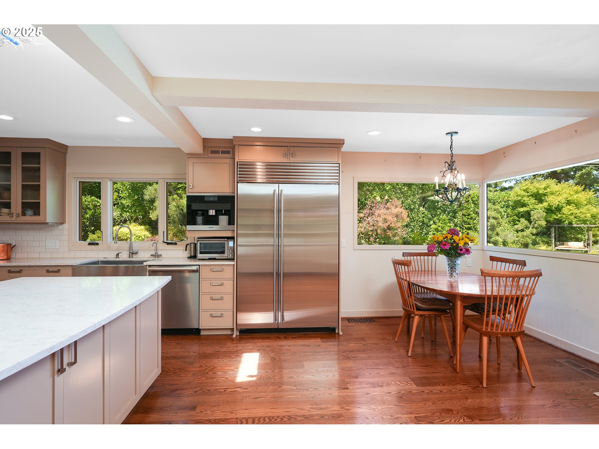 7131 Northwest Penridge Road Portland, OR 97229 - Photo 24 of 43 a kitchen with a table chairs and refrigerator