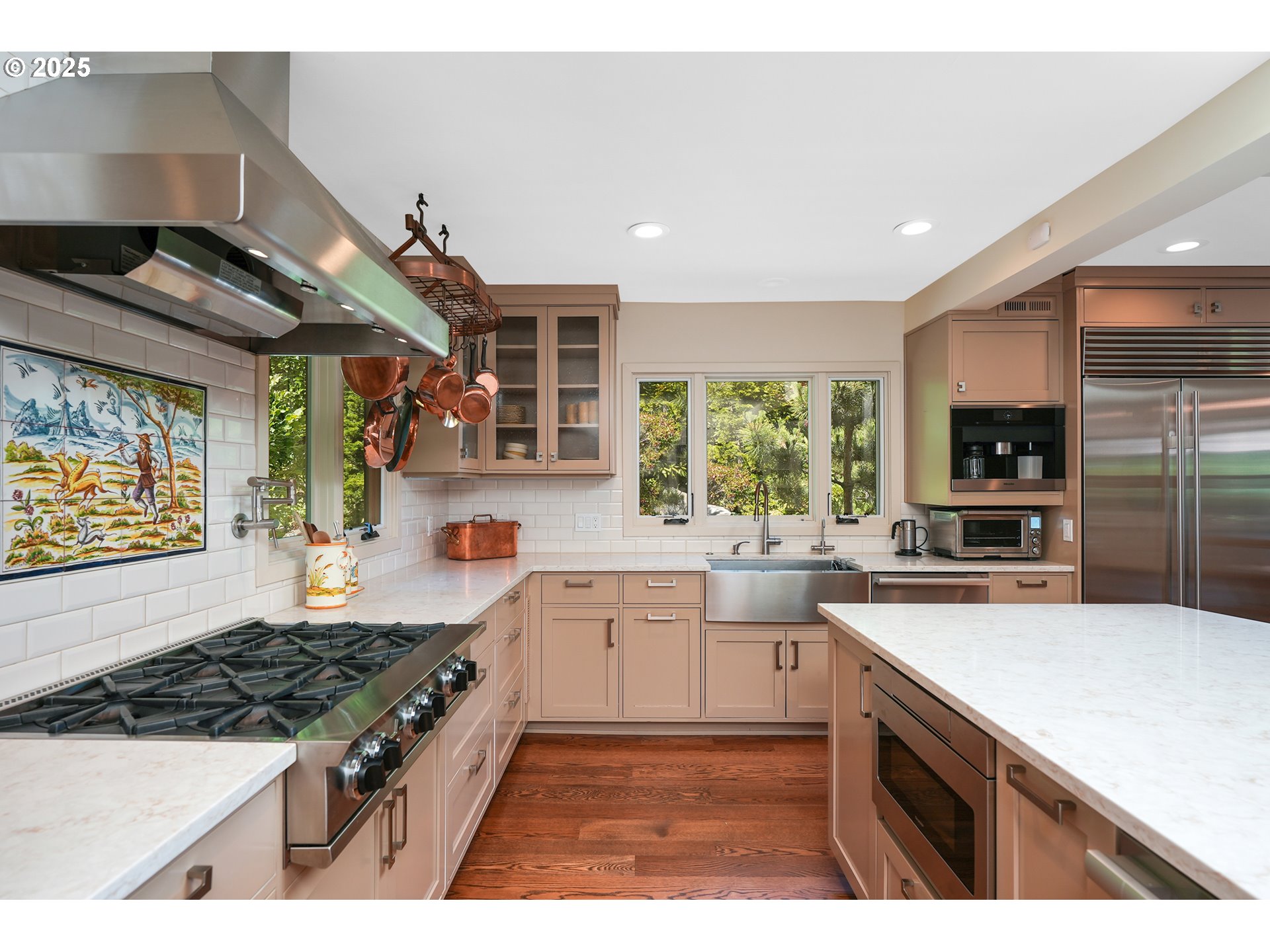 7131 Northwest Penridge Road Portland, OR 97229 - Photo 25 of 43 a kitchen with a sink stove and wooden cabinets