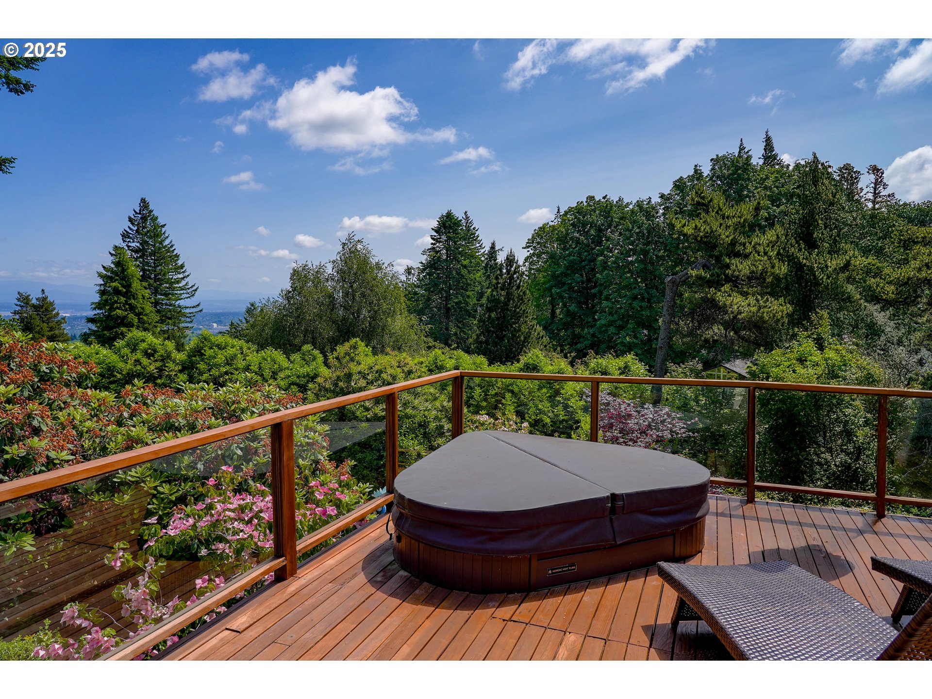 7131 Northwest Penridge Road Portland, OR 97229 - Photo 34 of 43 a view of a balcony with wooden floor and outdoor seating