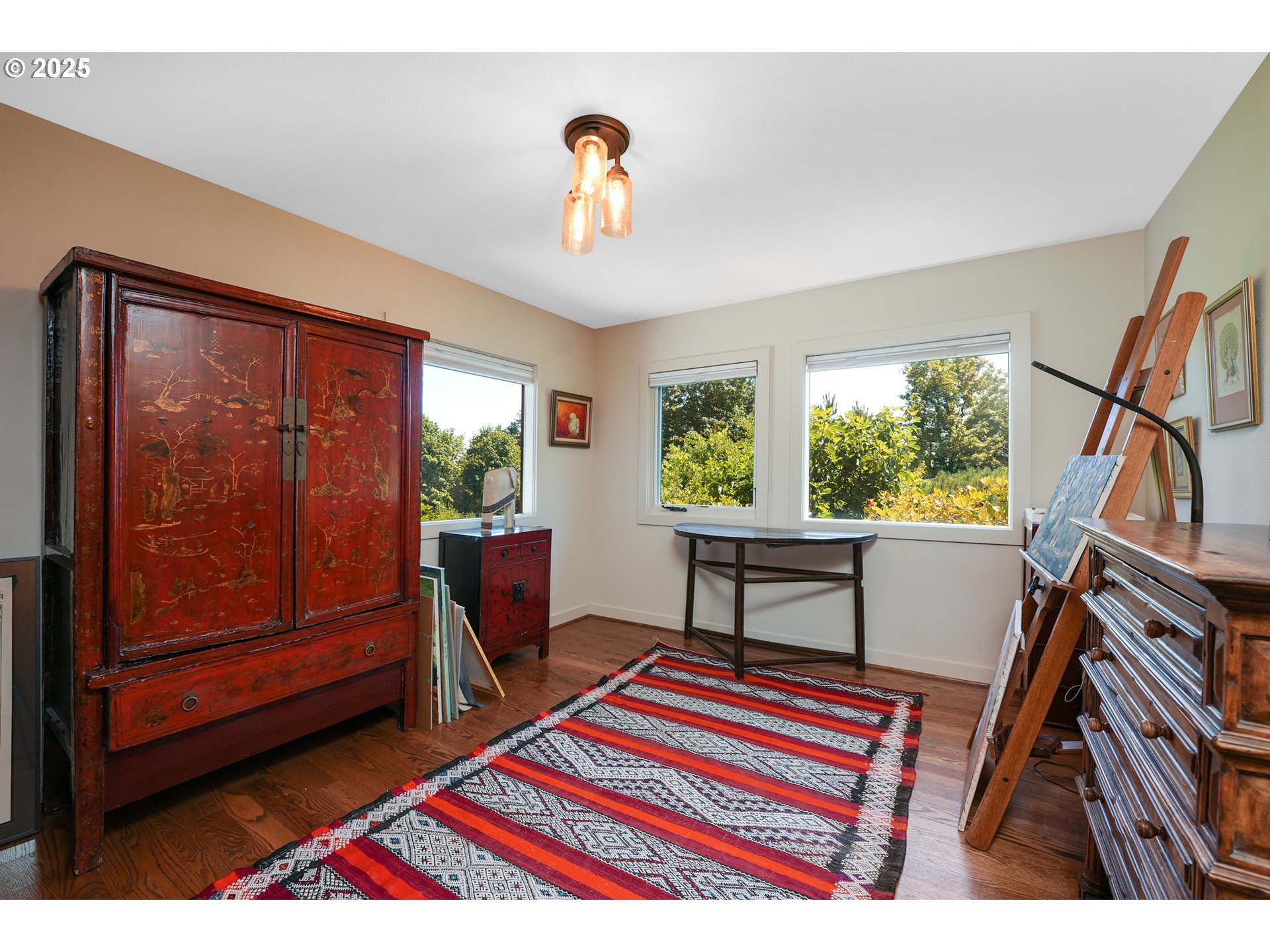 7131 Northwest Penridge Road Portland, OR 97229 - Photo 38 of 43 a bedroom with a bed and a window