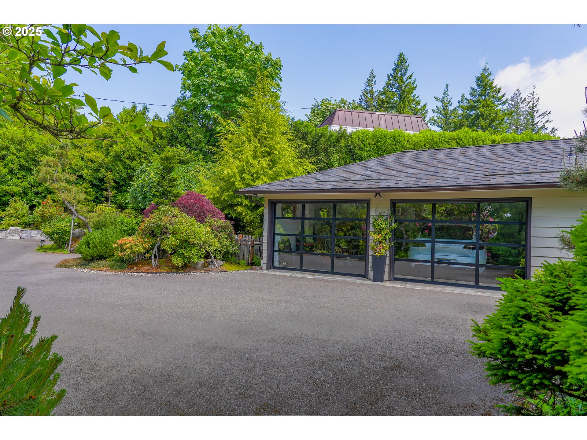 7131 Northwest Penridge Road Portland, OR 97229 - Photo 7 of 43 a view of an house with backyard and garden