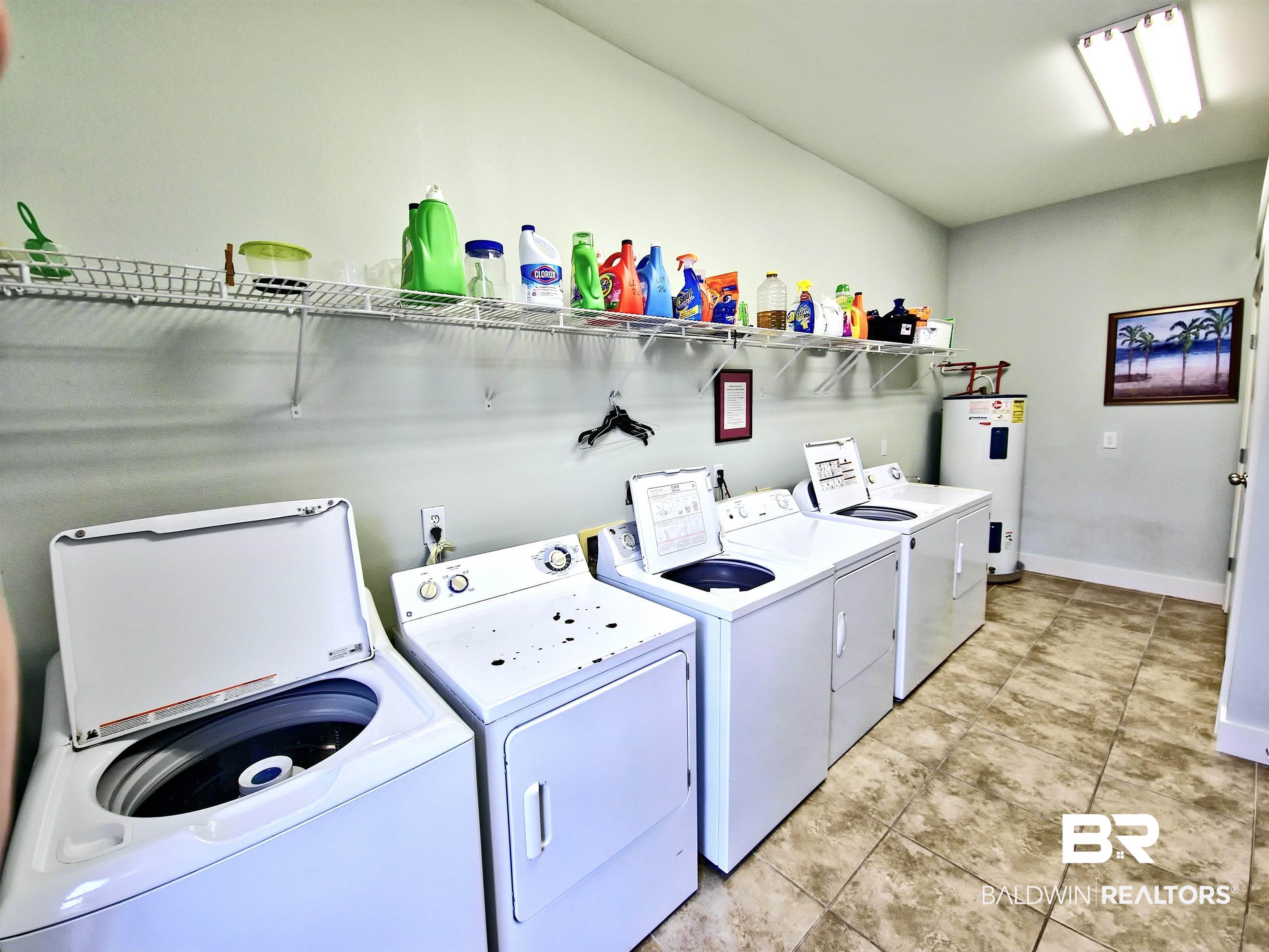 4650 Griffith Marina Road, Unit 12 Orange Beach, AL 36561 - Photo 22 of 34 Laundry room with independent washer and dryer and water heater