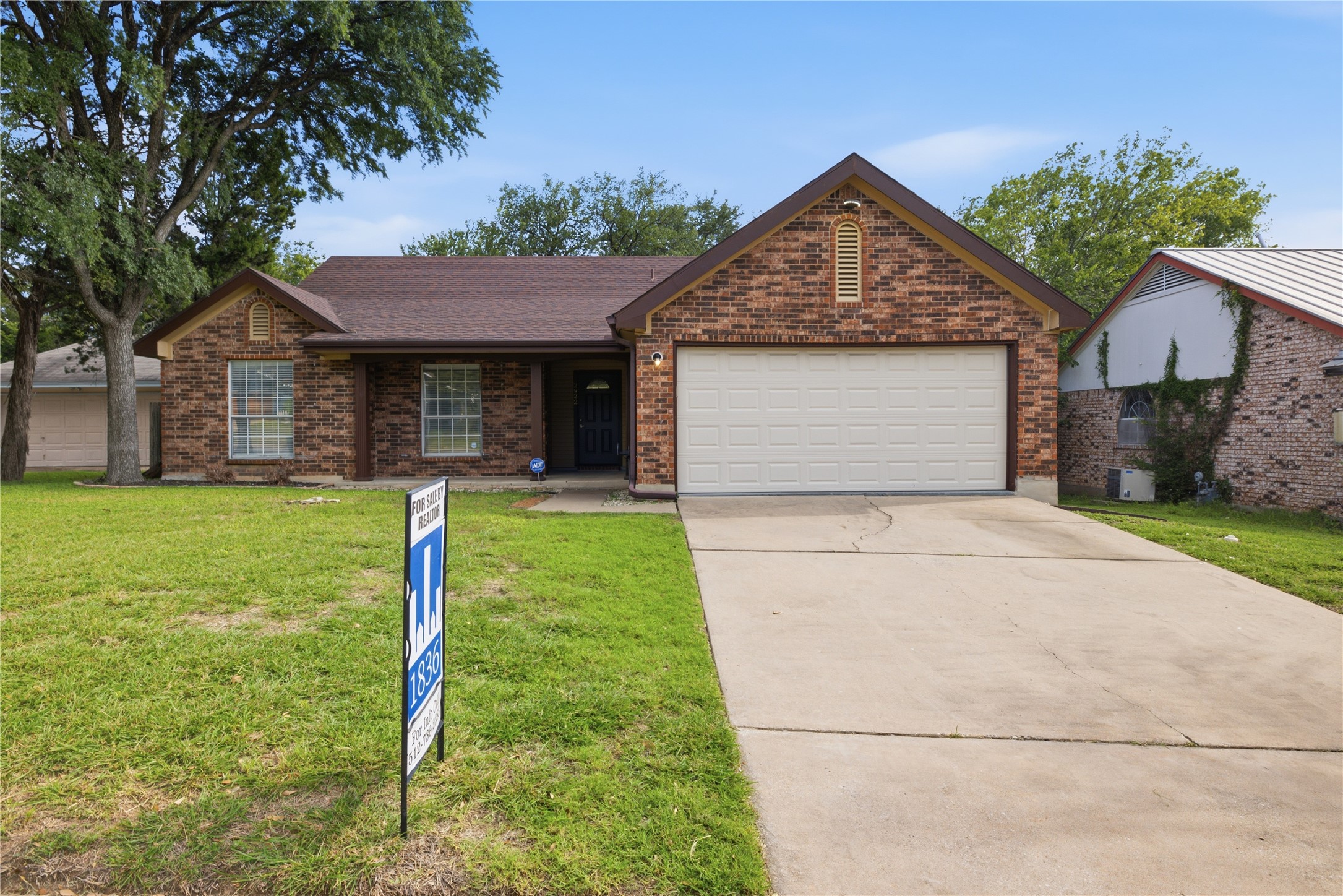 2922 Wickersham Lane Austin, TX 78741 - Photo 3 of 26 a front view of house with a garden