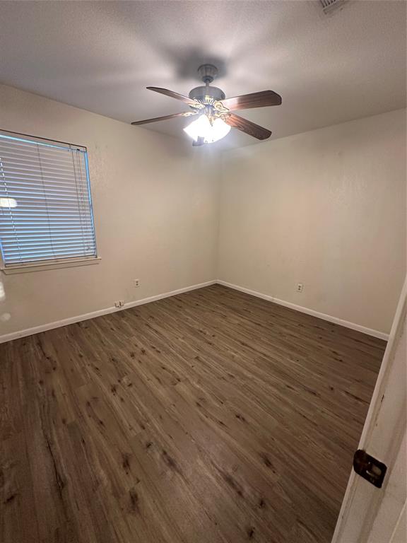 120 Don Propp Road Azle, TX 76020 - Photo 10 of 22 a view of a room with wooden floor and a ceiling fan