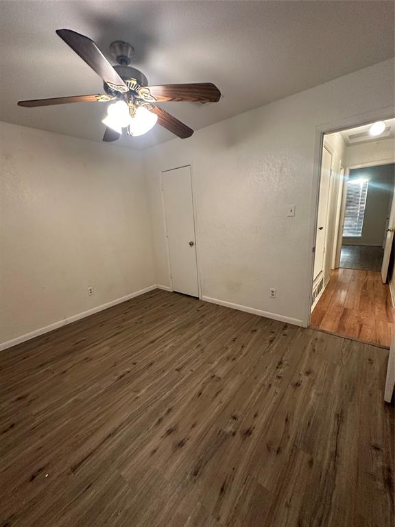 120 Don Propp Road Azle, TX 76020 - Photo 11 of 22 an empty room with wooden floor and fan
