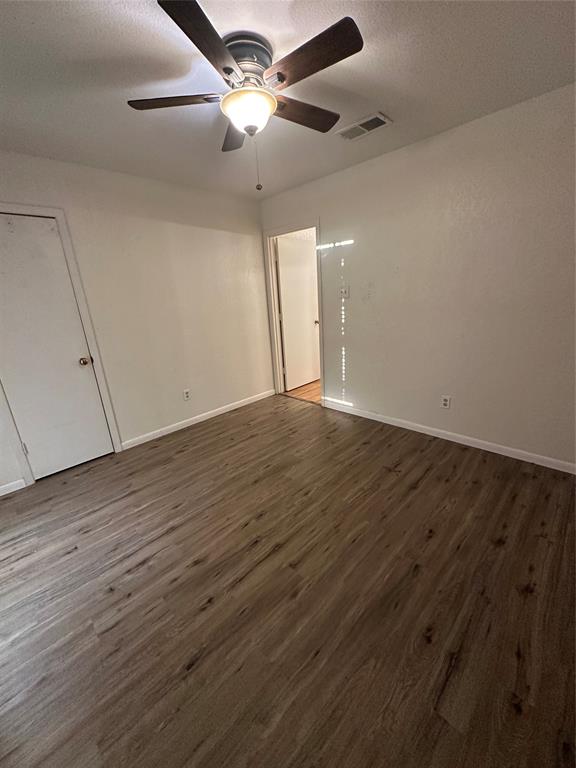 120 Don Propp Road Azle, TX 76020 - Photo 16 of 22 an empty room with wooden floor and a ceiling fan