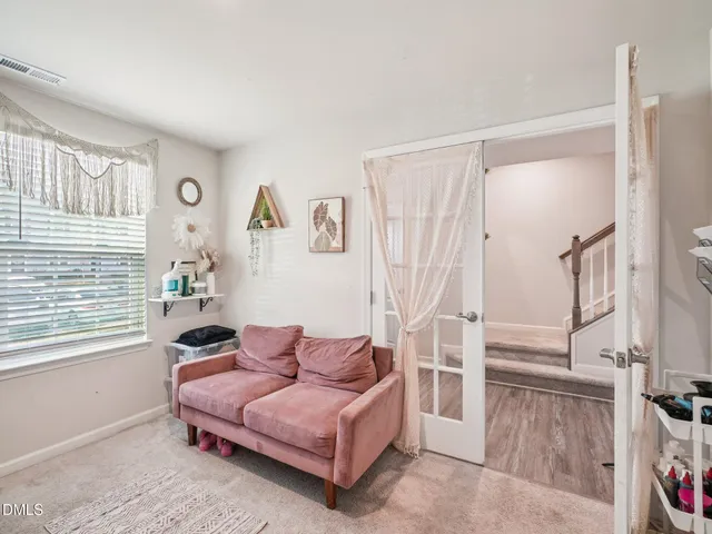 a living room with furniture and a window