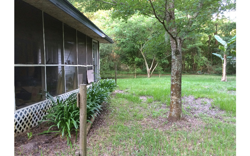54283 Lawhon Road South Callahan, FL 32011 - Photo 10 of 16 a view of a backyard with a garden