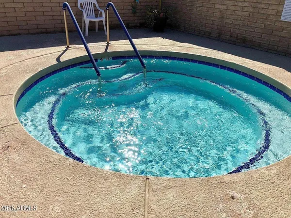 a view of a swimming pool with a backyard