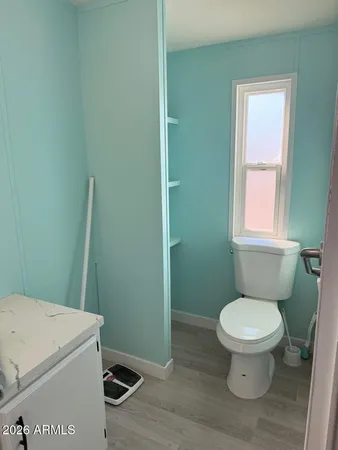 a bathroom with a toilet and a sink