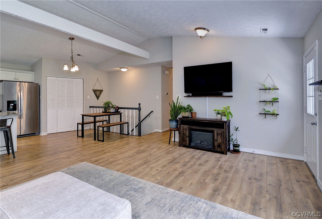 250 Reflection Drive Williamsburg, VA 23188 - Photo 11 of 42 a living room with furniture and a flat screen tv