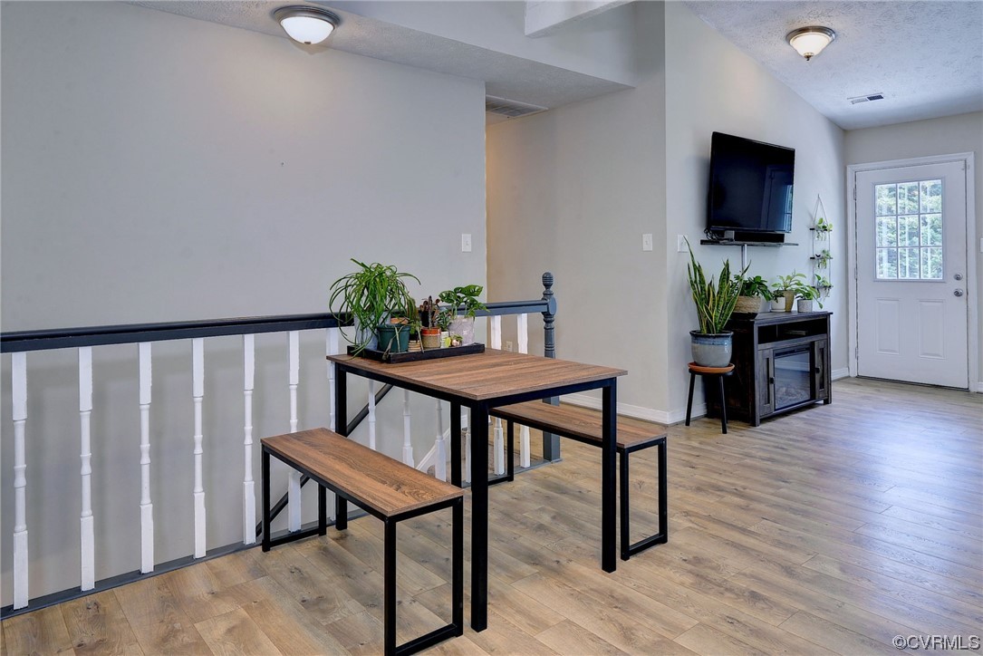 250 Reflection Drive Williamsburg, VA 23188 - Photo 17 of 42 a view of a livingroom with furniture and a flat screen tv