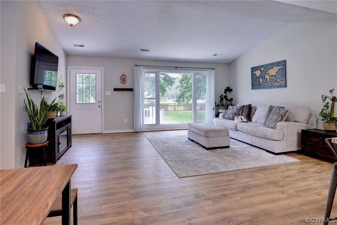 250 Reflection Drive Williamsburg, VA 23188 - Photo 18 of 42 a living room with furniture and a large window