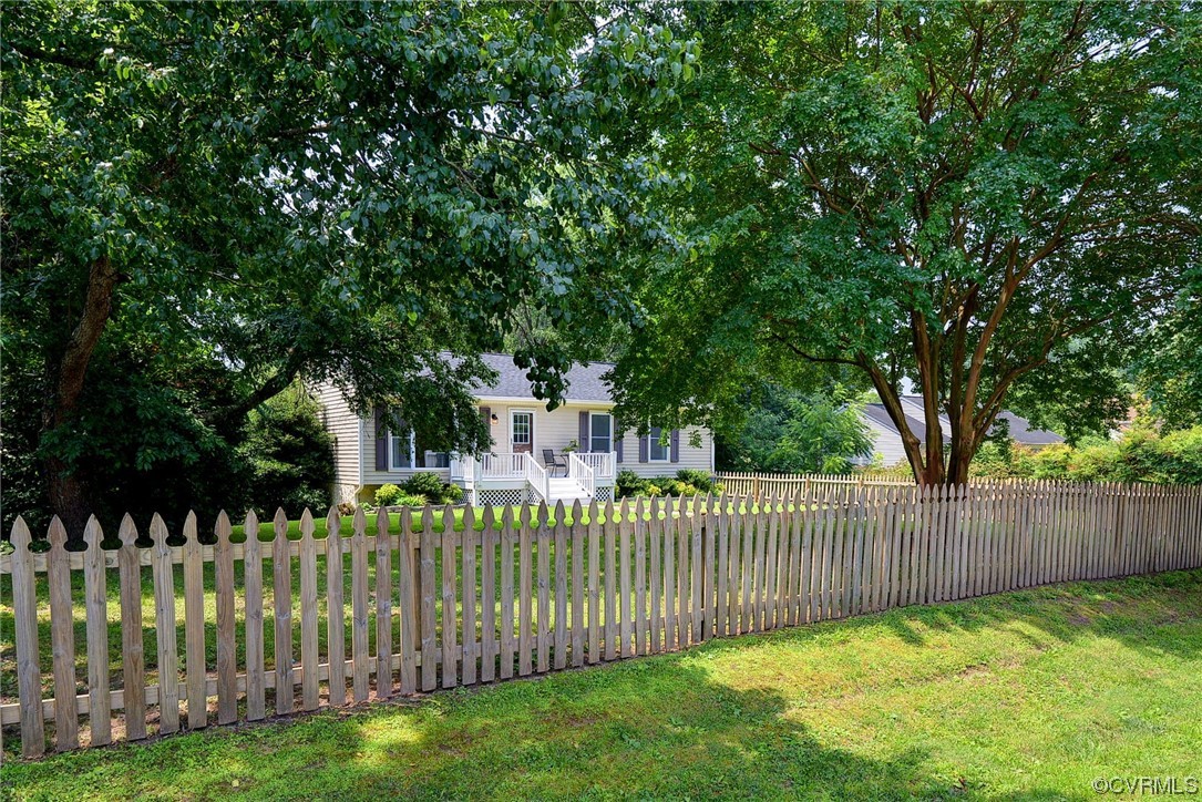 250 Reflection Drive Williamsburg, VA 23188 - Photo 2 of 42 a front view of a house having a garden