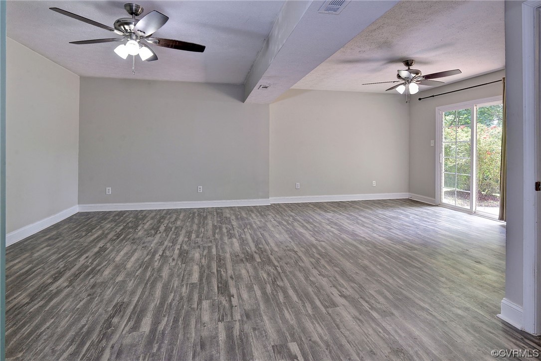 250 Reflection Drive Williamsburg, VA 23188 - Photo 25 of 42 a view of an empty room with a window and wooden floor