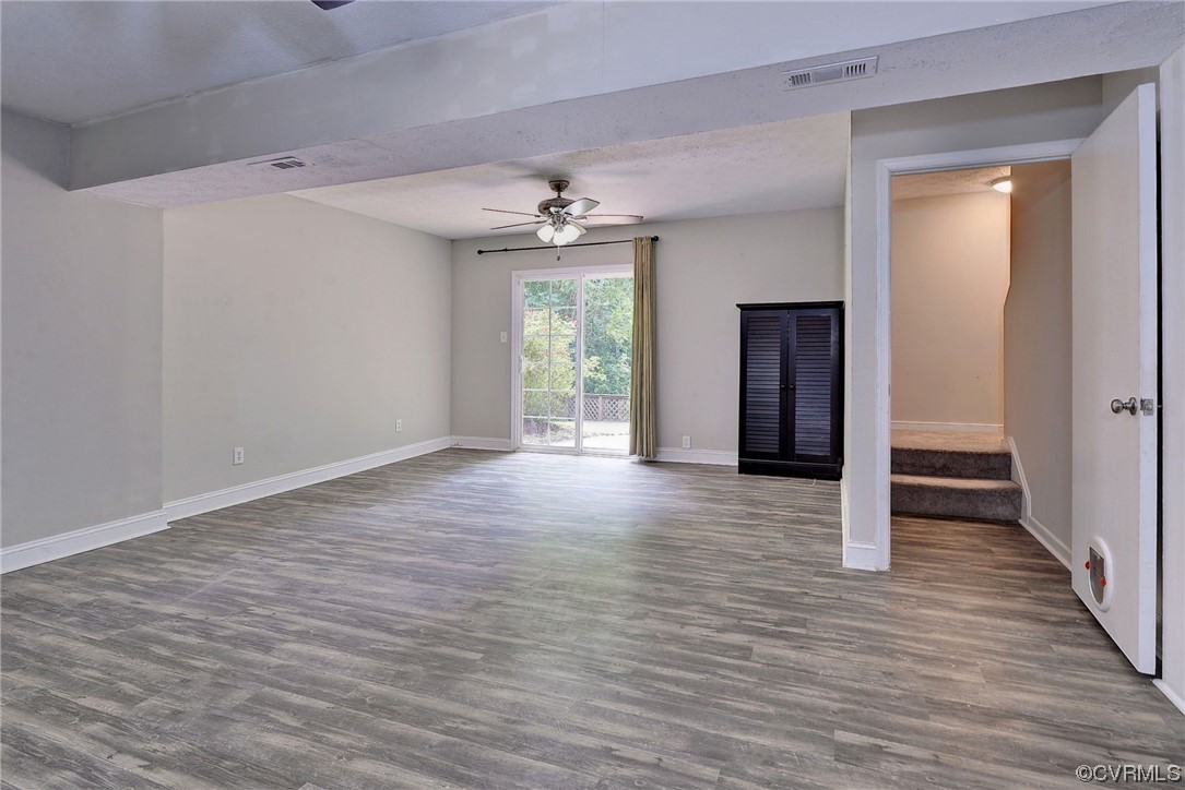 250 Reflection Drive Williamsburg, VA 23188 - Photo 26 of 42 a view of an empty room with wooden floor and a window