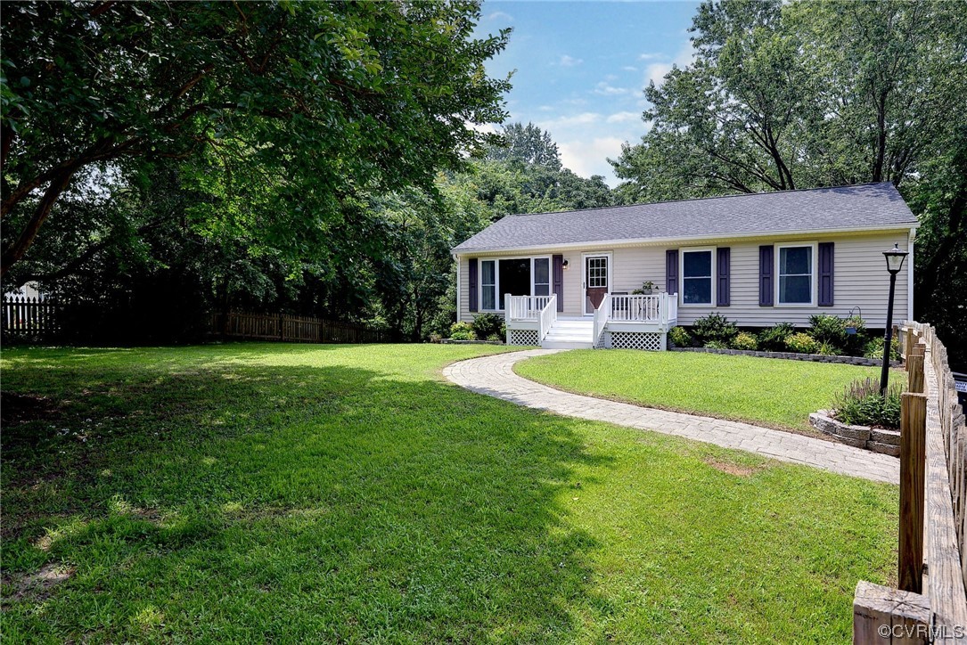 250 Reflection Drive Williamsburg, VA 23188 - Photo 3 of 42 a view of a house with a big yard potted plants and large trees