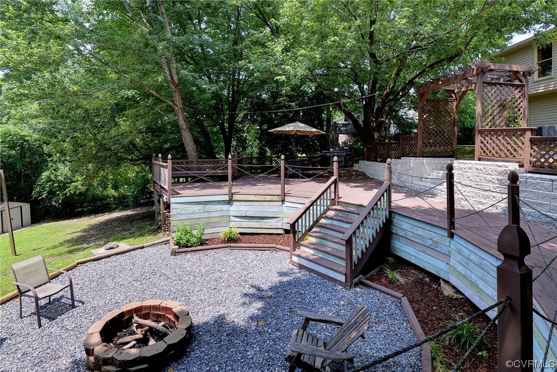 250 Reflection Drive Williamsburg, VA 23188 - Photo 32 of 42 a view of a park with wooden bench and trees