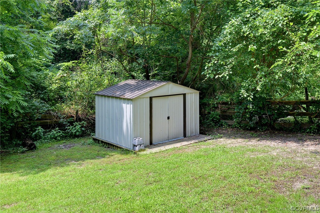 250 Reflection Drive Williamsburg, VA 23188 - Photo 39 of 42 a backyard of a house with lots of green space