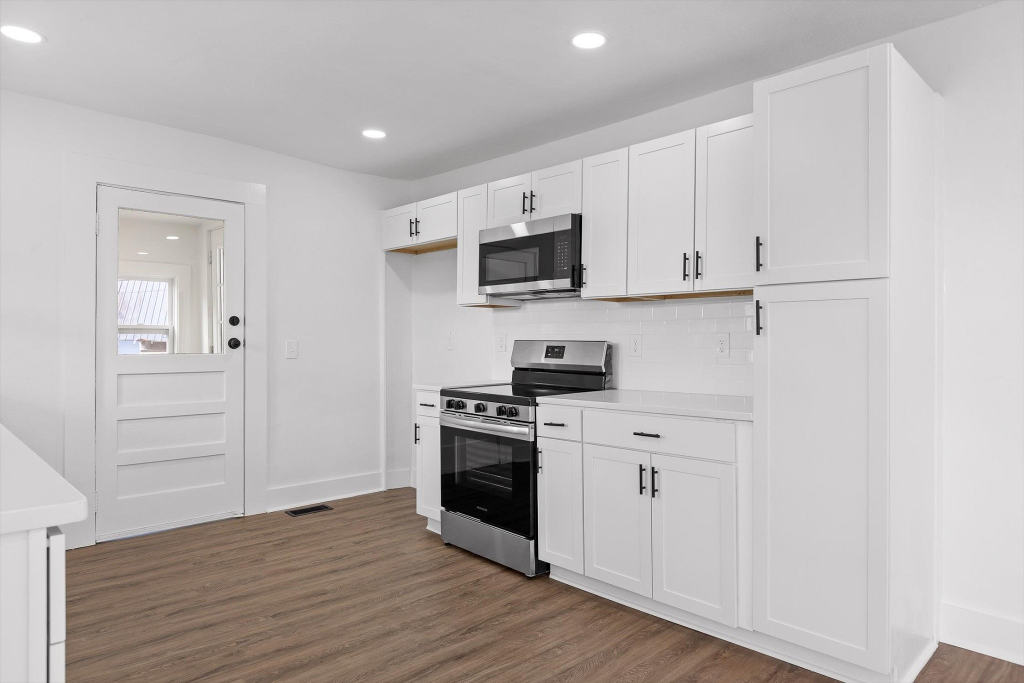 2917 East Crescent Circle Chattanooga, TN 37407 - Photo 11 of 45 a kitchen with stainless steel appliances granite countertop a stove a sink and a refrigerator