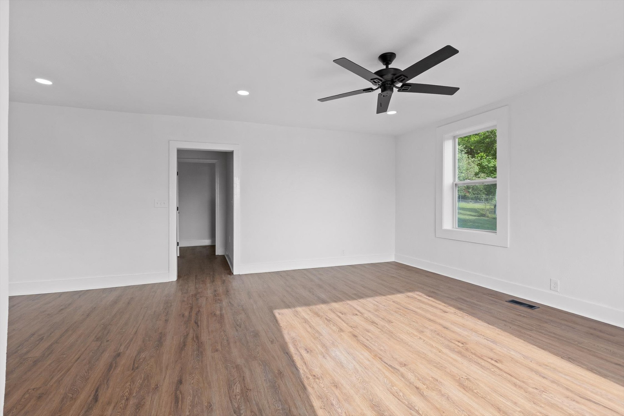 2917 East Crescent Circle Chattanooga, TN 37407 - Photo 17 of 45 a view of empty room with wooden floor and ceiling fan