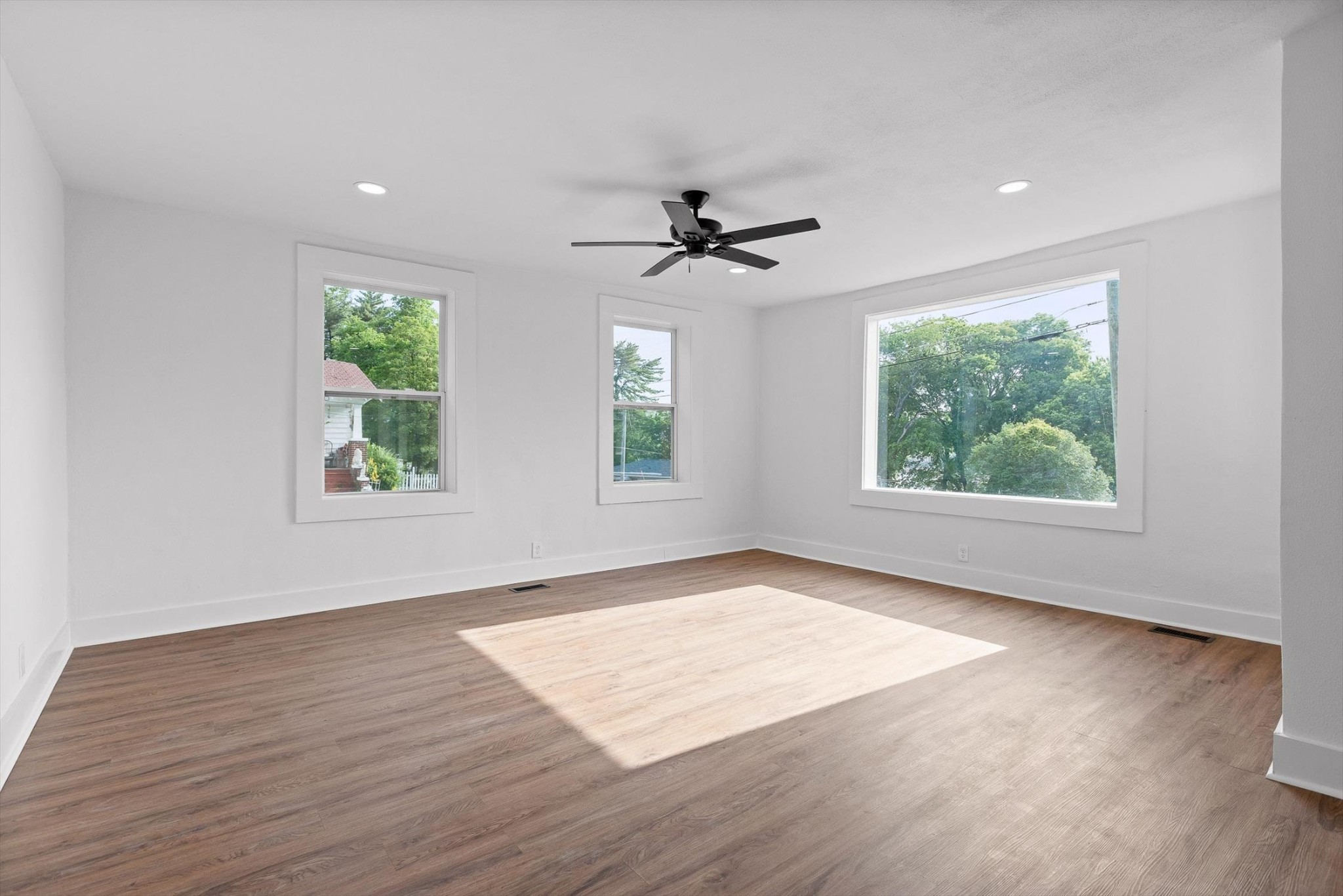 2917 East Crescent Circle Chattanooga, TN 37407 - Photo 18 of 45 an empty room with wooden floor and windows
