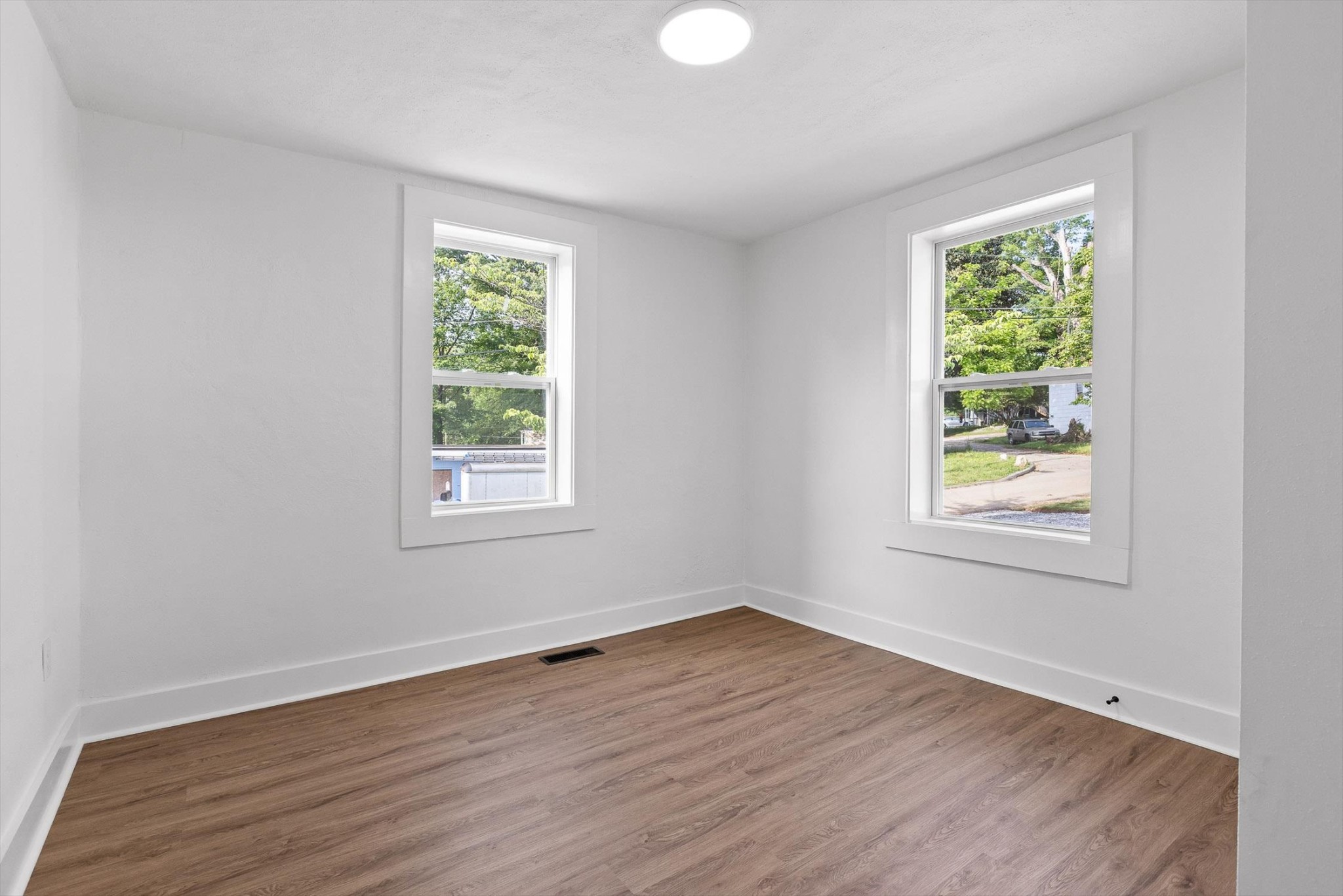 2917 East Crescent Circle Chattanooga, TN 37407 - Photo 24 of 45 a view of an empty room with wooden floor and a window