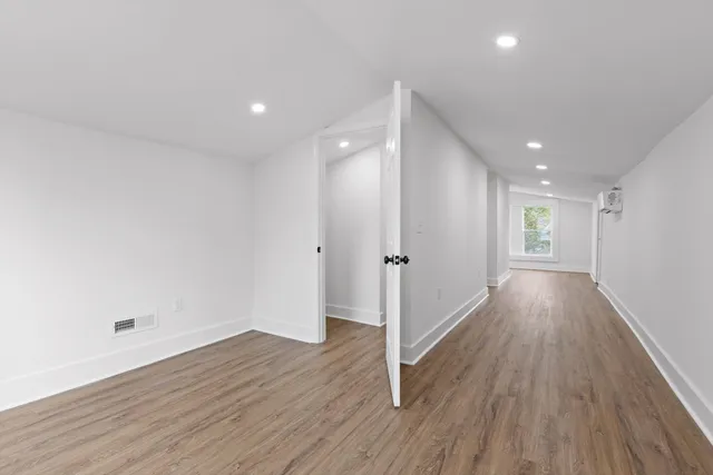 a view of entryway with wooden floor