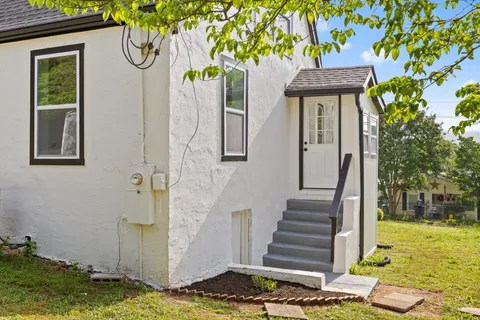 a front view of a house with garden