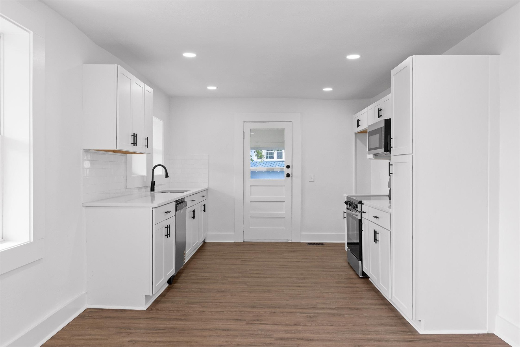 2917 East Crescent Circle Chattanooga, TN 37407 - Photo 10 of 45 a large kitchen with a refrigerator and a sink