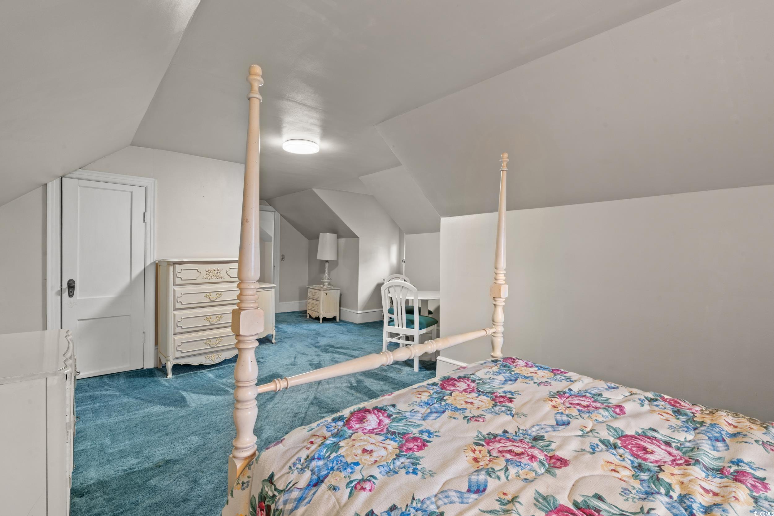 310 North Main Street Mullins, SC 29574 - Photo 17 of 35 Carpeted bedroom featuring vaulted ceiling