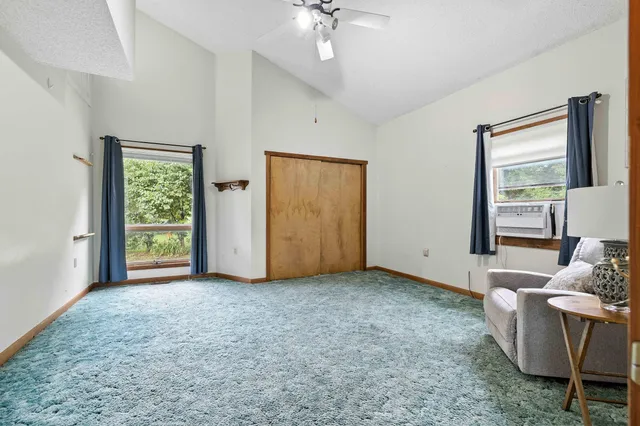 a white toilet sitting next to a bath tub and a shower
