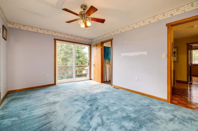 a view of a room with stairs and chandelier
